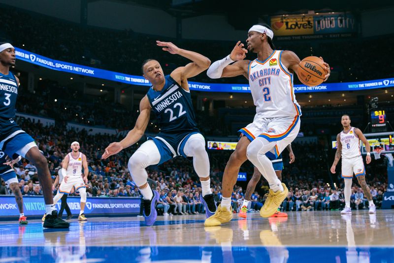 OKLAHOMA CITY, OKLAHOMA - FEBRUARY 24: Shai Gilgeous-Alexander #2 of the Oklahoma City Thunder goes to the basket around Jaylen Clark #22 of the Minnesota Timberwolves during the second quarter at Paycom Center on February 24, 2025 in Oklahoma City, Oklahoma. NOTE TO USER: User expressly acknowledges and agrees that, by downloading and or using this photograph, User is consenting to the terms and conditions of the Getty Images License Agreement. (Photo by William Purnell/Getty Images)