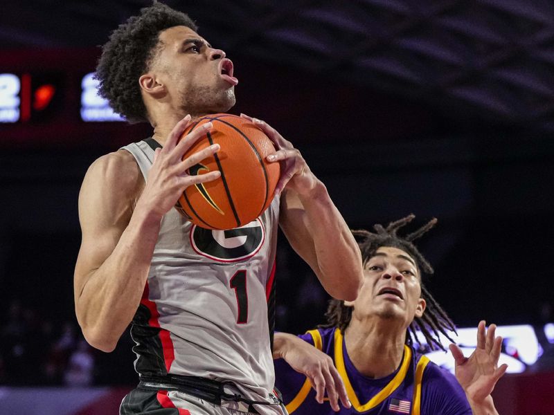 Feb 14, 2023; Athens, Georgia, USA; Georgia Bulldogs guard Jabri Abdur-Rahim (1) goes to the basket against LSU Tigers forward Jalen Reed (13) during the second half at Stegeman Coliseum. Mandatory Credit: Dale Zanine-USA TODAY Sports