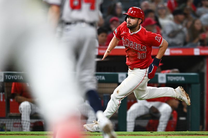 Aug 17, 2024; Anaheim, California, USA; Los Angeles Angels first baseman Nolan Schanuel (18) runs to home plate to score against the Atlanta Braves during the X inning at Angel Stadium. Mandatory Credit: Jonathan Hui-USA TODAY Sports