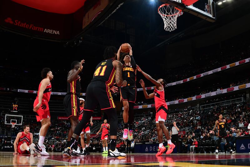 ATLANTA, GA - February 23:  Jalen Johnson #1 of the Atlanta Hawks drives to the basket during the game against the Toronto Raptors on February 23, 2024 at State Farm Arena in Atlanta, Georgia.  NOTE TO USER: User expressly acknowledges and agrees that, by downloading and/or using this Photograph, user is consenting to the terms and conditions of the Getty Images License Agreement. Mandatory Copyright Notice: Copyright 2024 NBAE (Photo by Scott Cunningham/NBAE via Getty Images)