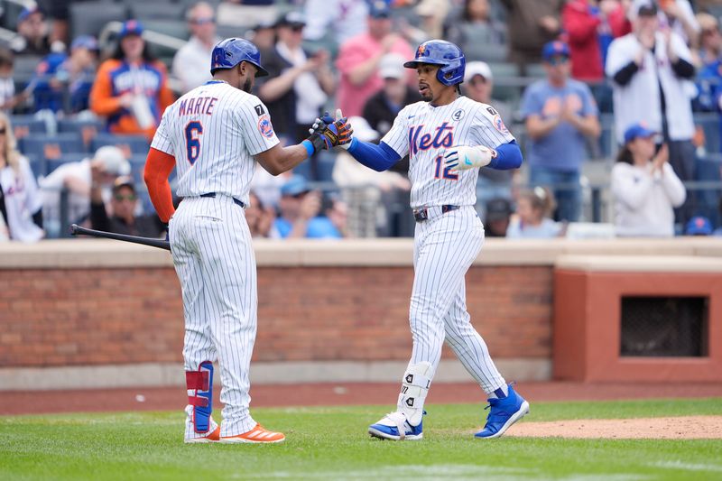Jun 1, 2025; New York City, New York, USA; New York Mets left fielder Starling Marte (6) congratulates New York Mets shortstop Francisco Lindor (12) for hitting a home run against the Colorado Rockies during the fifth inning at Citi Field. Mandatory Credit: Gregory Fisher-Imagn Images