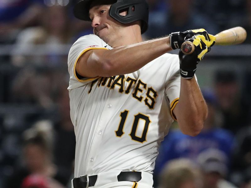 Apr 30, 2025; Pittsburgh, Pennsylvania, USA;  Pittsburgh Pirates right fielder Bryan Reynolds (10) hits a single against the Chicago Cubs during the seventh inning at PNC Park. Mandatory Credit: Charles LeClaire-Imagn Images