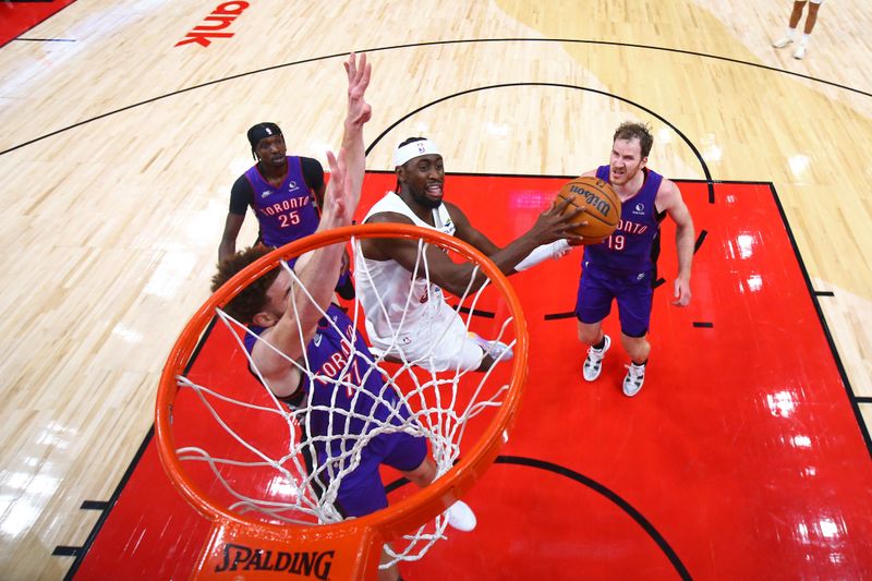 TORONTO, CANADA - OCTOBER 23: Caris LeVert #3 of the Cleveland Cavaliers drives to the basket during the game against the Toronto Raptors on October 23, 2024 at the Scotiabank Arena in Toronto, Ontario, Canada.  NOTE TO USER: User expressly acknowledges and agrees that, by downloading and or using this Photograph, user is consenting to the terms and conditions of the Getty Images License Agreement.  Mandatory Copyright Notice: Copyright 2024 NBAE (Photo by Vaughn Ridley/NBAE via Getty Images)