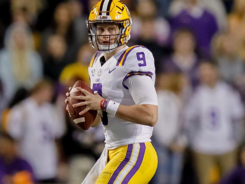 Nov 23, 2019; Baton Rouge, LA, USA; LSU Tigers quarterback Joe Burrow (9) prepares to throw the ball against Arkansas Razorbacks during the first half at Tiger Stadium. Mandatory Credit: Stephen Lew-USA TODAY Sports