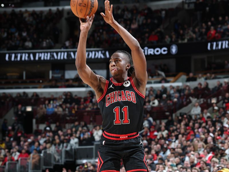 CHICAGO, IL - JANUARY 27: Ayo Dosunmu #11 of the Chicago Bulls three point basket during the game against the Denver Nuggets on January 27, 2025 at United Center in Chicago, Illinois. NOTE TO USER: User expressly acknowledges and agrees that, by downloading and or using this photograph, User is consenting to the terms and conditions of the Getty Images License Agreement. Mandatory Copyright Notice: Copyright 2025 NBAE (Photo by Jeff Haynes/NBAE via Getty Images)