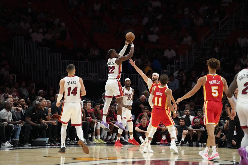 MIAMI, FL - OCTOBER 16: Jimmy Butler #22 of the Miami Heat shoots a three point basket during the game against the Atlanta Hawks during a preseason game on October 16, 2024 at Kaseya Center in Miami, Florida. NOTE TO USER: User expressly acknowledges and agrees that, by downloading and or using this Photograph, user is consenting to the terms and conditions of the Getty Images License Agreement. Mandatory Copyright Notice: Copyright 2024 NBAE (Photo by Eric Espada/NBAE via Getty Images)