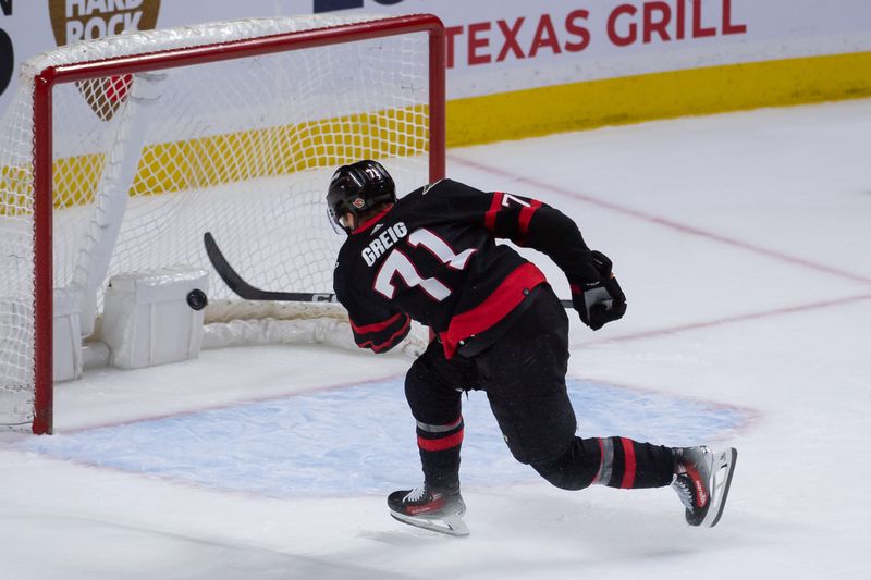 Feb 10, 2024; Ottawa, Ontario, CAN; Ottawa Senators center Ridly Greig (71) scores an empty net goal to seal the win against the Toronto Maple Leafs in the third period at the Canadian Tire Centre. Mandatory Credit: Marc DesRosiers-USA TODAY Sports