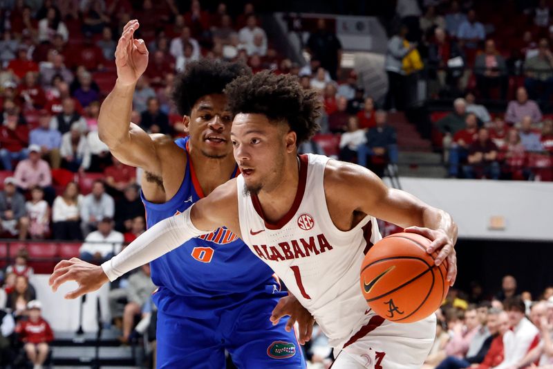 Feb 21, 2024; Tuscaloosa, Alabama, USA; Alabama Crimson Tide guard Mark Sears (1) drives the baseline around Florida Gators guard Zyon Pullin (0) during the first half at Coleman Coliseum. Mandatory Credit: Butch Dill-USA TODAY Sports