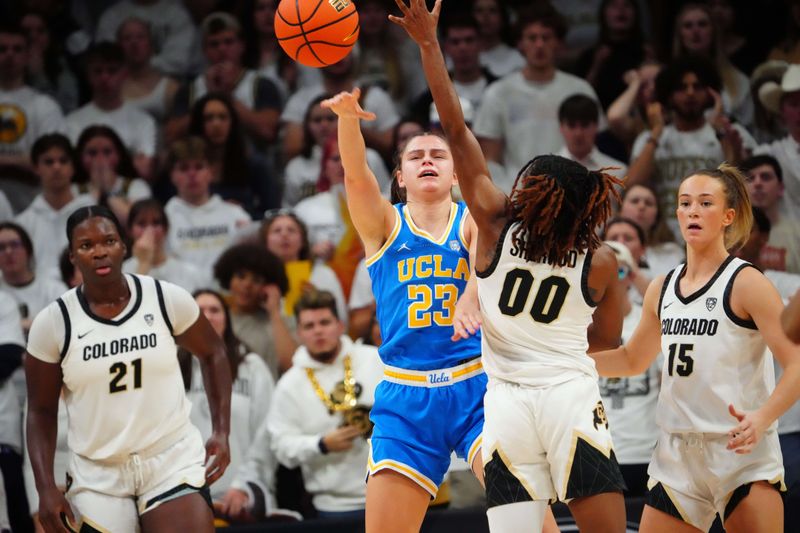 Jan 19, 2024; Boulder, Colorado, USA;  UCLA Bruins forward Gabriela Jaquez (23) passes the ball over Colorado Buffaloes guard Jaylyn Sherrod (00) during the second half at the CU Events Center. Mandatory Credit: Ron Chenoy-USA TODAY Sports
\v11