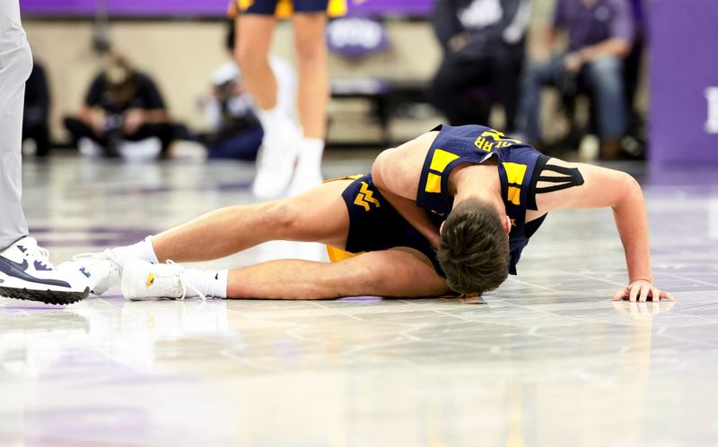 Feb 12, 2024; Fort Worth, Texas, USA; West Virginia Mountaineers guard Kerr Kriisa (3) reacts after an injury during the second half against the TCU Horned Frogs at Ed and Rae Schollmaier Arena. Mandatory Credit: Kevin Jairaj-USA TODAY Sports