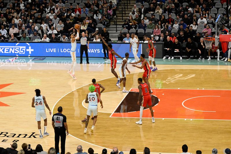 SAN ANTONIO, TX - DECEMBER 8: Victor Wembanyama #1 of the San Antonio Spurs shoots a three point basket off a pass from Chris Paul to to move to number two all-time in assists during the game  against the New Orleans Pelicans on December 8, 2024 at the Frost Bank Center in San Antonio, Texas. NOTE TO USER: User expressly acknowledges and agrees that, by downloading and or using this photograph, user is consenting to the terms and conditions of the Getty Images License Agreement. Mandatory Copyright Notice: Copyright 2024 NBAE (Photos by David Dow/NBAE via Getty Images)