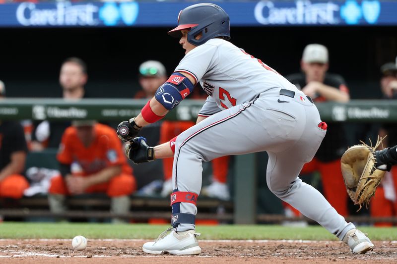 May 17, 2025; Baltimore, Maryland, USA; Washington Nationals outfielder Alex Call (17) lays down a sacrifice bunt during the ninth inning against the Baltimore Orioles at Oriole Park at Camden Yards. Mandatory Credit: Daniel Kucin Jr.-Imagn Images
