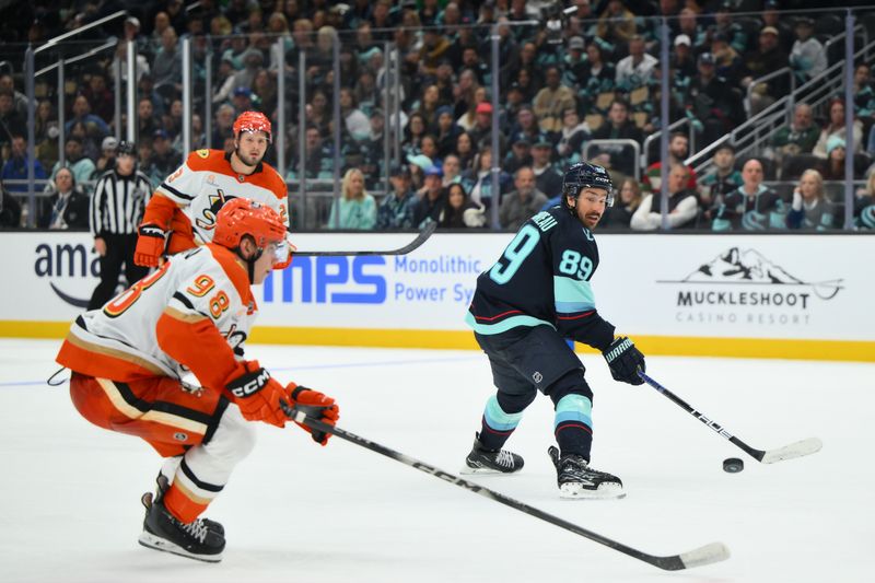 Oct 9, 2025; Seattle, Washington, USA; Seattle Kraken center Frederick Gaudreau (89) passes the puck against the Anaheim Ducks during the second period at Climate Pledge Arena. Mandatory Credit: Steven Bisig-Imagn Images