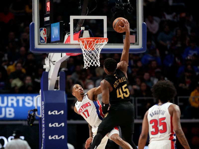 DETROIT, MI - NOVEMBER 27: Donovan Mitchell #45 of the Cleveland Cavaliers dunks the ball againt Rodney McGruder #17 of the Detroit Pistons on November 27, 2022 at Little Caesars Arena in Detroit, Michigan. NOTE TO USER: User expressly acknowledges and agrees that, by downloading and/or using this photograph, User is consenting to the terms and conditions of the Getty Images License Agreement. Mandatory Copyright Notice: Copyright 2022 NBAE (Photo by Brian Sevald/NBAE via Getty Images)