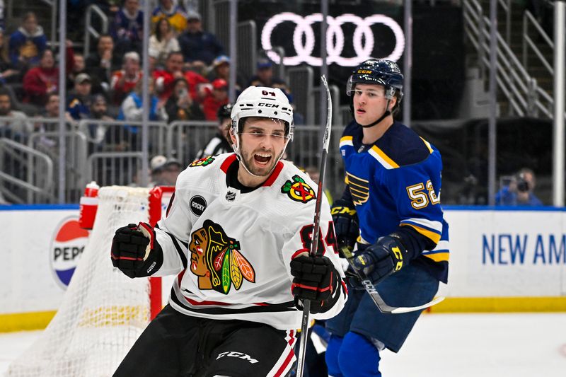 Apr 10, 2024; St. Louis, Missouri, USA;  Chicago Blackhawks left wing Landon Slaggert (84) reacts after scoring his first career NHL goal during the third period against the St. Louis Blues at Enterprise Center. Mandatory Credit: Jeff Curry-USA TODAY Sports