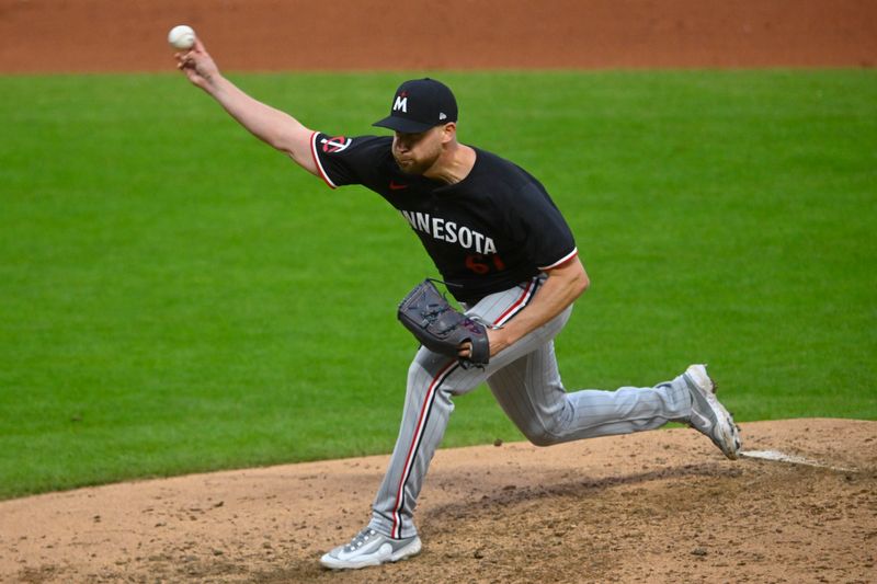 Apr 30, 2025; Cleveland, Ohio, USA; Minnesota Twins relief pitcher Brock Stewart (61) delivers a pitch in the seventh inning against the Cleveland Guardians at Progressive Field. Mandatory Credit: David Richard-Imagn Images