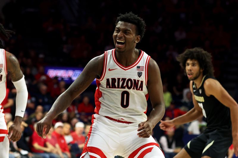 Jan 4, 2024; Tucson, Arizona, USA; Arizona Wildcats guard Jaden Bradley (0) after shooting a basket against Colorado Buffaloes guard Javon Ruffin (11) during the second half at McKale Center. Mandatory Credit: Zachary BonDurant-USA TODAY Sports