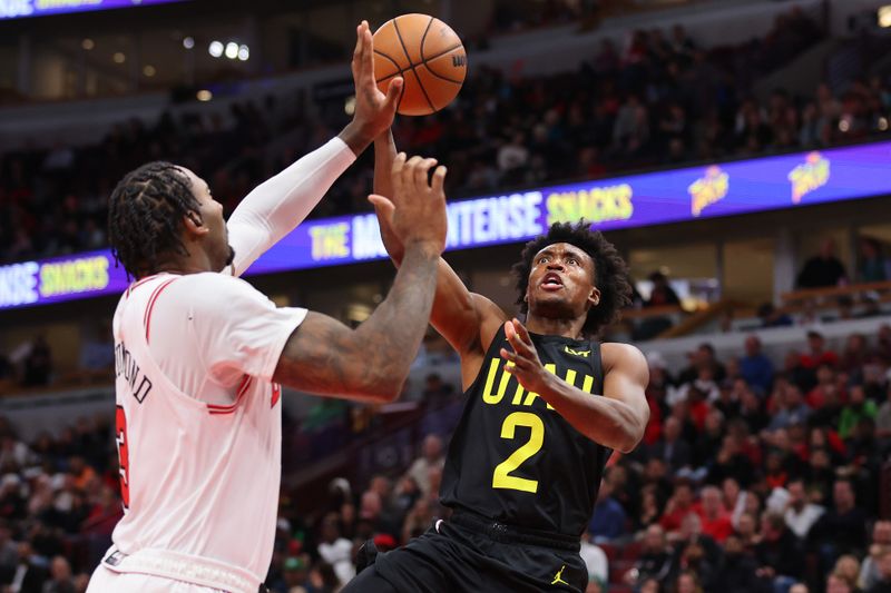 CHICAGO, ILLINOIS - NOVEMBER 06: Collin Sexton #2 of the Utah Jazz goes up for a layup against Andre Drummond #3 of the Chicago Bulls during the second half at the United Center on November 06, 2023 in Chicago, Illinois. NOTE TO USER: User expressly acknowledges and agrees that, by downloading and or using this photograph, User is consenting to the terms and conditions of the Getty Images License Agreement. (Photo by Michael Reaves/Getty Images)