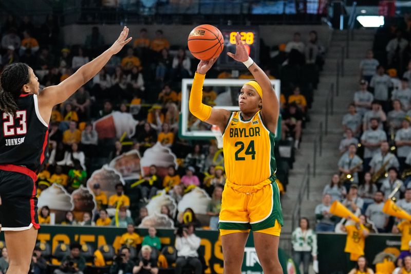 Feb 18, 2024; Waco, Texas, USA;  Baylor Lady Bears guard Sarah Andrews (24) scores a three point basket against Texas Tech Red Raiders guard Loghan Johnson (23) during the second half at Paul and Alejandra Foster Pavilion. Mandatory Credit: Chris Jones-USA TODAY Sports