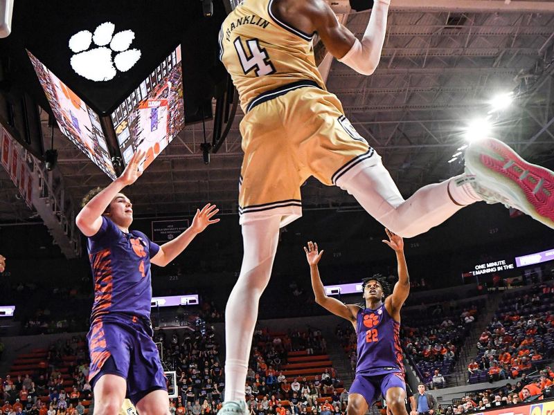 Jan 24, 2023; Clemson, South Carolina, USA; Clemson sophomore forward Ian Schieffelin (4) and Clemson forward RJ Godfrey (22) guard Georgia Tech forward Ja'Von Franklin (4) saving a ball from going out, during the second half at Littlejohn Coliseum. Mandatory Credit: Ken Ruinard-USA TODAY Sports