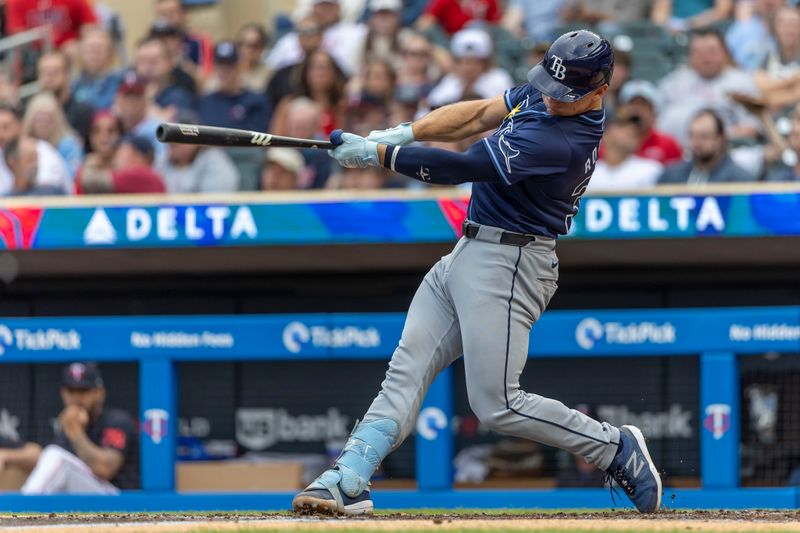 Jun 19, 2024; Minneapolis, Minnesota, USA; Tampa Bay Rays catcher Ben Rortvedt (30) hits a double against the Minnesota Twins in the second inning at Target Field. Mandatory Credit: Jesse Johnson-USA TODAY Sports