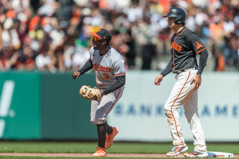 Jun 4, 2023; San Francisco, California, USA; Baltimore Orioles shortstop Jorge Mateo (3) reacts after tagging out San Francisco Giants designated hitter Wilmer Flores (41) and throws to first base for a double play during the eighth inning at Oracle Park. Mandatory Credit: John Hefti-USA TODAY Sports