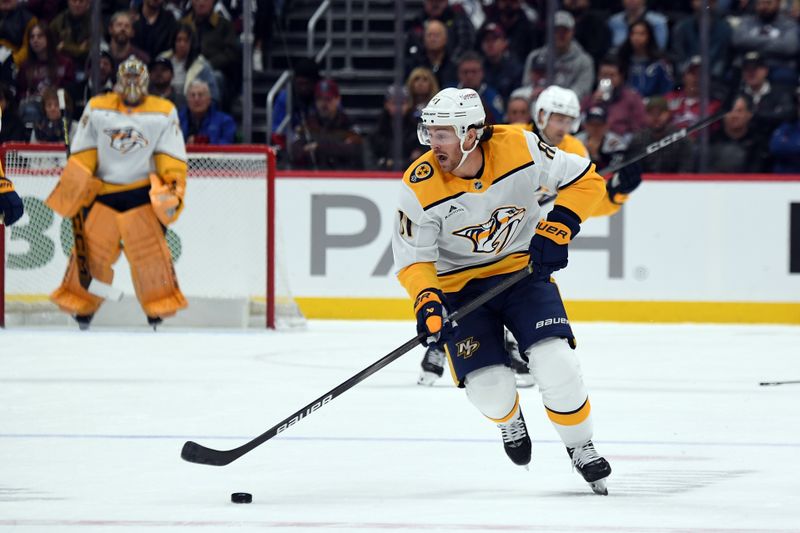 Nov 11, 2024; Denver, Colorado, USA; Nashville Predators center Jonathan Marchessault (81) skates with the puck during the first period against the Colorado Avalanche at Ball Arena. Mandatory Credit: Christopher Hanewinckel-Imagn Images