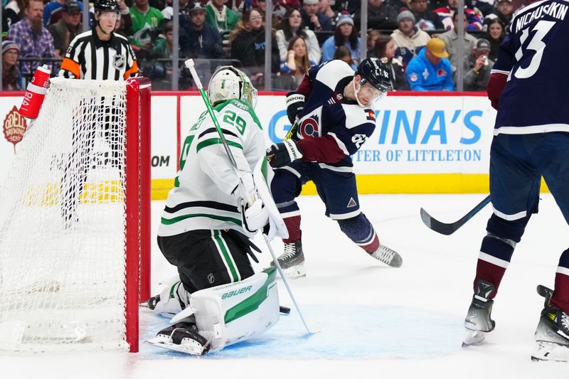 Apr 7, 2024; Denver, Colorado, USA; Colorado Avalanche left wing Artturi Lehkonen (62) scores on Dallas Stars goaltender Jake Oettinger (29) in the second period at Ball Arena. Mandatory Credit: Ron Chenoy-USA TODAY Sports