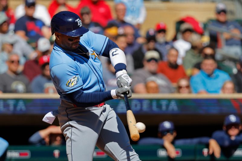 Sep 13, 2023; Minneapolis, Minnesota, USA; Tampa Bay Rays first baseman Yandy Diaz (2) hits a two-run double against the Minnesota Twins in the second inning at Target Field. Mandatory Credit: Bruce Kluckhohn-USA TODAY Sports