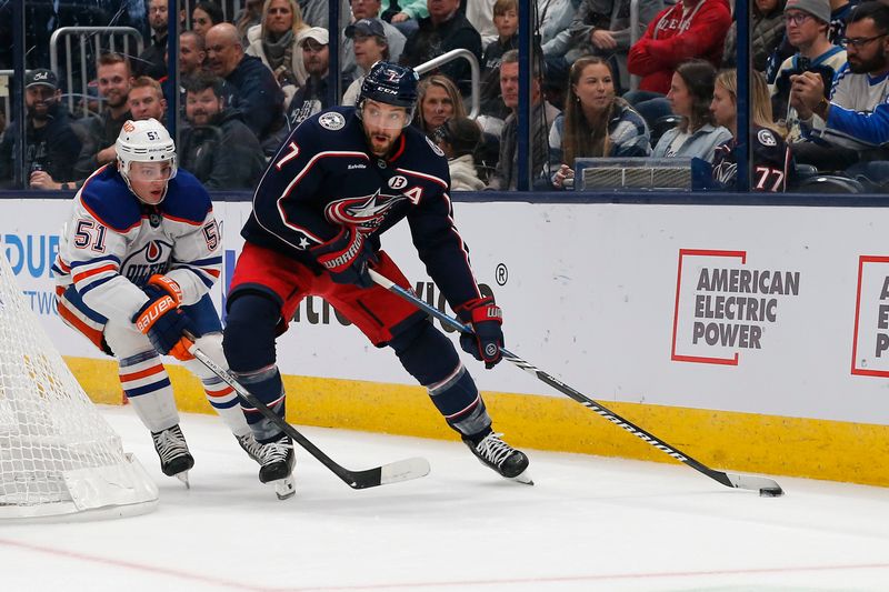 Oct 28, 2024; Columbus, Ohio, USA; Columbus Blue Jackets center Sean Kuraly (7) looks to pass as Edmonton Oilers defenseman Troy Stecher (51) trails the play during the second period at Nationwide Arena. Mandatory Credit: Russell LaBounty-Imagn Images