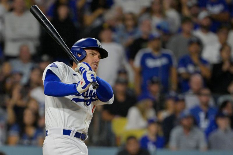 Jul 19, 2024; Los Angeles, California, USA;  Los Angeles Dodgers first base Freddie Freeman (5) hits a grand slam home run in the eighth inning against the Boston Red Sox at Dodger Stadium. Mandatory Credit: Jayne Kamin-Oncea-USA TODAY Sports