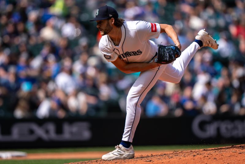Apr 9, 2025; Seattle, Washington, USA;  Seattle Mariners reliever Collin Snider (52)delivers a pitch during the sixth inning against the Houston Astros at T-Mobile Park. Mandatory Credit: Stephen Brashear-Imagn Images