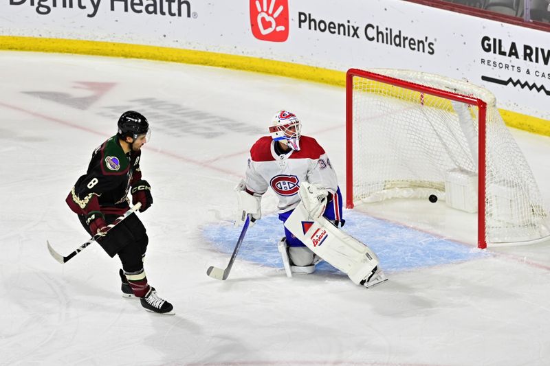 Nov 2, 2023; Tempe, Arizona, USA;  Arizona Coyotes center Nick Schmaltz (8) scores on Montreal Canadiens goaltender Jake Allen (34) during a penalty shot in the first period at Mullett Arena. Mandatory Credit: Matt Kartozian-USA TODAY Sports