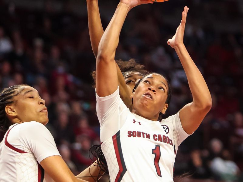 Dec 3, 2022; Columbia, South Carolina, USA; South Carolina Gamecocks guard Zia Cooke (1) grabs a rebound over Memphis Tigers center Destiny Thomas (34) in the first half at Colonial Life Arena. Mandatory Credit: Jeff Blake-USA TODAY Sports