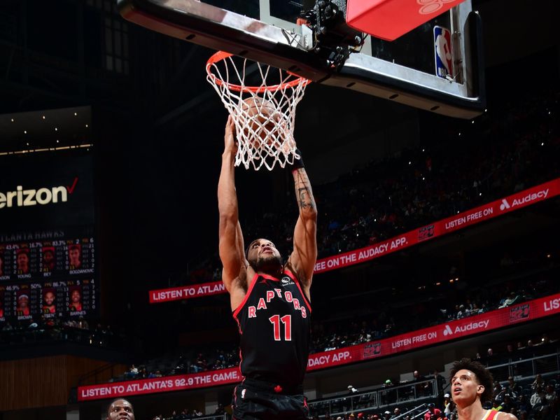 ATLANTA, GA - JANUARY 28: Bruce Brown #11 of the Toronto Raptors drives to the basket during the game against the Atlanta Hawks on January 28, 2024 at State Farm Arena in Atlanta, Georgia.  NOTE TO USER: User expressly acknowledges and agrees that, by downloading and/or using this Photograph, user is consenting to the terms and conditions of the Getty Images License Agreement. Mandatory Copyright Notice: Copyright 2024 NBAE (Photo by Scott Cunningham/NBAE via Getty Images)