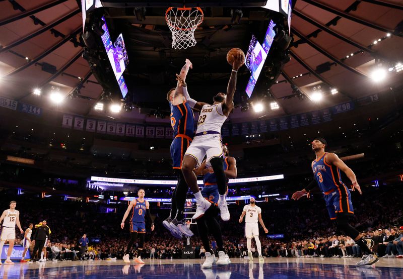 NEW YORK, NEW YORK - FEBRUARY 03:  LeBron James #23 of the Los Angeles Lakers shoots against Isaiah Hartenstein #55 of the New York Knicks during their game at Madison Square Garden on February 03, 2024 in New York City.   User expressly acknowledges and agrees that, by downloading and or using this photograph, User is consenting to the terms and conditions of the Getty Images License Agreement.  (Photo by Al Bello/Getty Images)