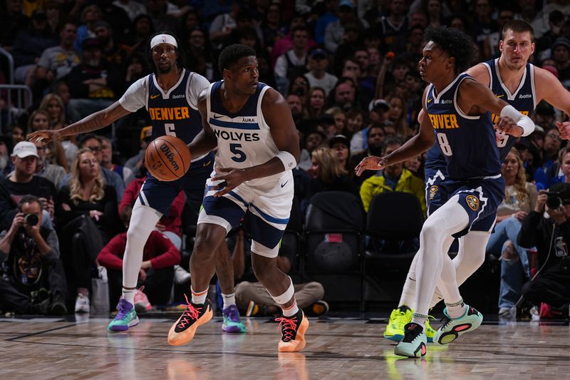 DENVER, CO - APRIL 10: Anthony Edwards #5 of the Minnesota Timberwolves handles the ball during the game against the Denver Nuggets on April 10, 2024 at the Ball Arena in Denver, Colorado. NOTE TO USER: User expressly acknowledges and agrees that, by downloading and/or using this Photograph, user is consenting to the terms and conditions of the Getty Images License Agreement. Mandatory Copyright Notice: Copyright 2024 NBAE (Photo by Bart Young/NBAE via Getty Images)