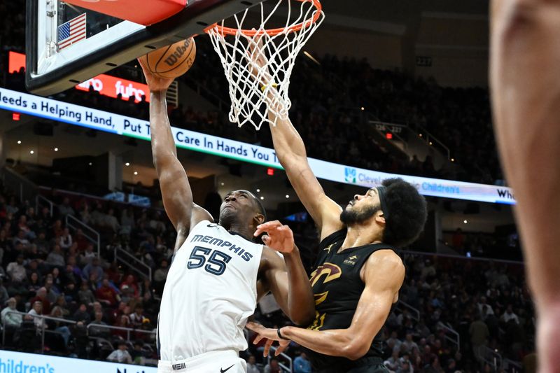 CLEVELAND, OHIO - APRIL 10: Trey Jemison #55 of the Memphis Grizzlies shoots against Jarrett Allen #31 of the Cleveland Cavaliers during the second half at Rocket Mortgage Fieldhouse on April 10, 2024 in Cleveland, Ohio. NOTE TO USER: User expressly acknowledges and agrees that, by downloading and or using this photograph, User is consenting to the terms and conditions of the Getty Images License Agreement. (Photo by Nick Cammett/Getty Images)