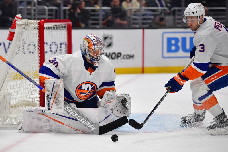 Mar 11, 2024; Los Angeles, California, USA; New York Islanders defenseman Adam Pelech (3) gets the rebound in front of goaltender Ilya Sorokin (30) during the second period at Crypto.com Arena. Mandatory Credit: Gary A. Vasquez-USA TODAY Sports