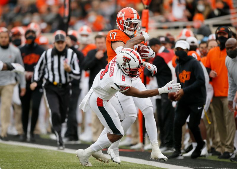 Nov 28, 2020; Oklahoma State Cowboys wide receiver Dillon Stoner (17) is pushed out by Texas Tech Red Raiders defensive back Zech McPhearson (8) during a football game at Boone Pickens Stadium. Mandatory Credit: Bryan Terry-USA TODAY Sports
