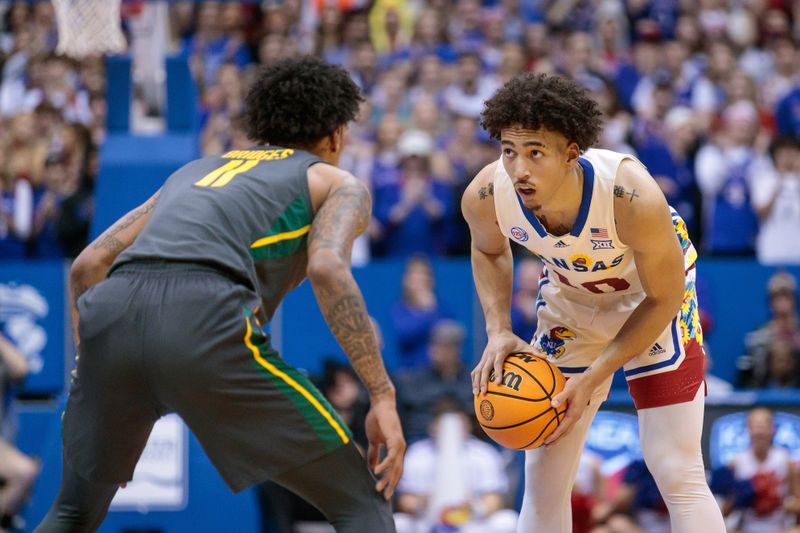 Feb 18, 2023; Lawrence, Kansas, USA; Kansas Jayhawks forward Jalen Wilson (10) controls the ball against Baylor Bears forward Jalen Bridges (11) during the second half at Allen Fieldhouse. Mandatory Credit: William Purnell-USA TODAY Sports