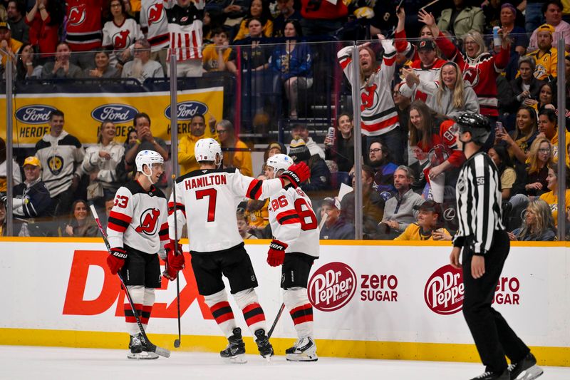 Mar 26, 2026; Nashville, Tennessee, USA; New Jersey Devils center Jack Hughes (86) celebrates with his teammates after scoring a goal against the Nashville Predators during the first period at Bridgestone Arena. Mandatory Credit: Steve Roberts-Imagn Images Mar 26, 2026; Nashville, Tennessee, USA; New Jersey Devils center Jack Hughes (86) celebrates with his teammates after scoring a goal against the Nashville Predators during the first period at Bridgestone Arena. Mandatory Credit: Steve Roberts-Imagn Images