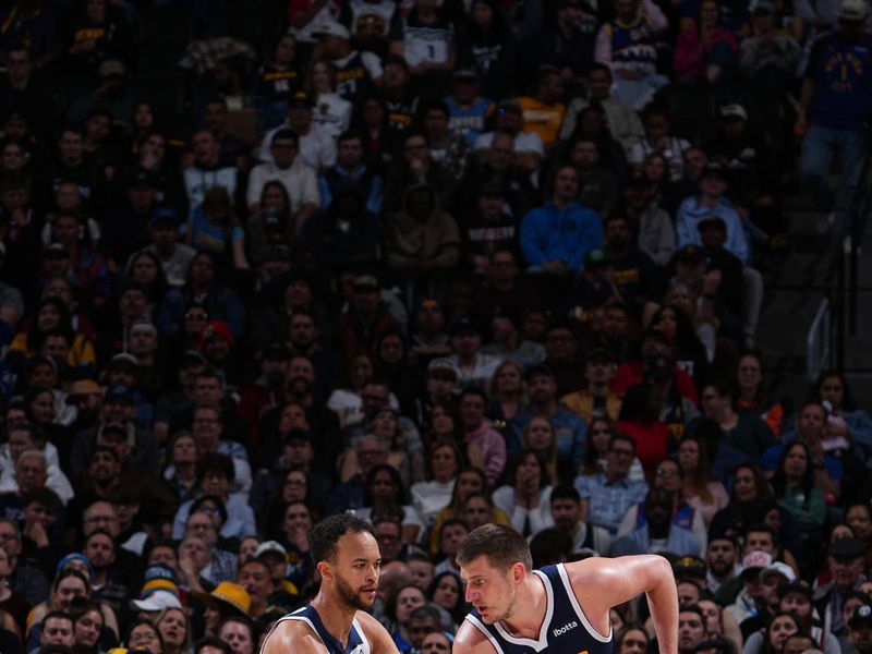 DENVER, CO - APRIL 10: Kyle Anderson #1 of the Minnesota Timberwolves plays defense against Nikola Jokic #15 of the Denver Nuggets on April 10, 2024 at the Ball Arena in Denver, Colorado. NOTE TO USER: User expressly acknowledges and agrees that, by downloading and/or using this Photograph, user is consenting to the terms and conditions of the Getty Images License Agreement. Mandatory Copyright Notice: Copyright 2024 NBAE (Photo by Garrett Ellwood/NBAE via Getty Images)