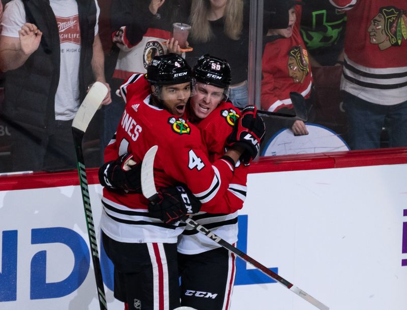 Apr 6, 2024; Chicago, Illinois, USA; Chicago Blackhawks defenseman Seth Jones (4) celebrates after scoring a goal against the Dallas Stars during the second period at United Center. Mandatory Credit: Seeger Gray-USA TODAY Sports