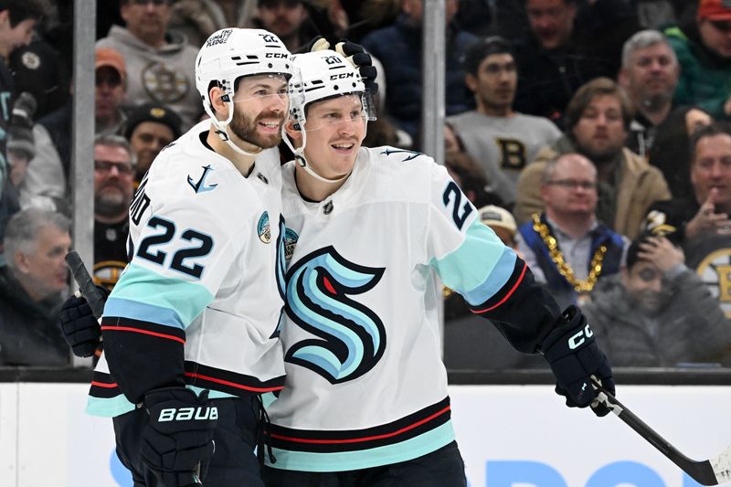 Feb 15, 2024; Boston, Massachusetts, USA; Seattle Kraken right wing Eeli Tolvanen (20) celebrates with right wing Oliver Bjorkstrand (22) after scoring a goal against the Boston Bruins during the second period at the TD Garden. Mandatory Credit: Brian Fluharty-USA TODAY Sports