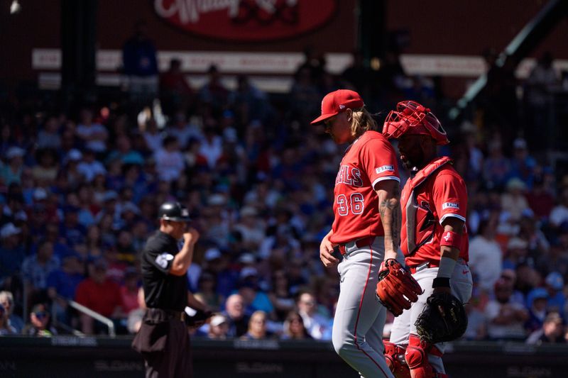 Feb 27, 2025; Mesa, Arizona, USA; Los Angeles Angels pitcher Caden Dana (36) walks with catcher Chuckie Robinson (33) in the first inning of a spring training game against the Chicago Cubs at Sloan Park. Mandatory Credit: Allan Henry-Imagn Images