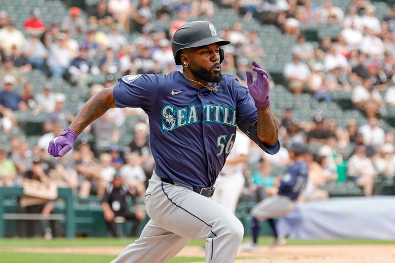 Jul 28, 2024; Chicago, Illinois, USA; Seattle Mariners outfielder Randy Arozarena (56) runs after hitting a single against the Chicago White Sox during the second inning at Guaranteed Rate Field. Mandatory Credit: Kamil Krzaczynski-USA TODAY Sports