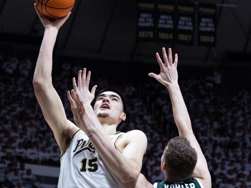 Jan 29, 2023; West Lafayette, Indiana, USA; Purdue Boilermakers center Zach Edey (15) shoots the ball while Michigan State Spartans forward Jaxon Kohler (0) defends in the second half at Mackey Arena. Mandatory Credit: Trevor Ruszkowski-USA TODAY Sports