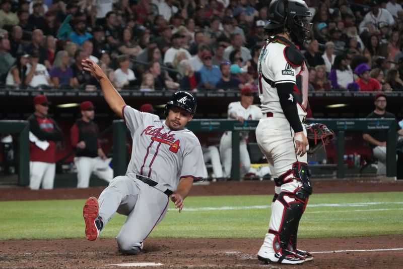 Apr 27, 2025; Phoenix, Arizona, USA; Atlanta Braves catcher Drake Baldwin (30) scores a run against the Arizona Diamondbacks in the seventh inning at Chase Field. Mandatory Credit: Rick Scuteri-Imagn Images