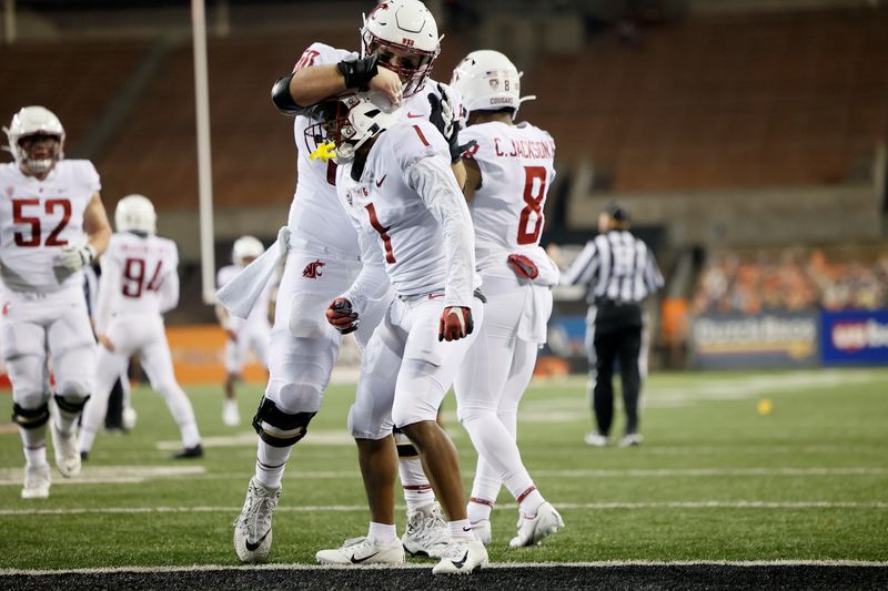 Nov 7, 2020; Corvallis, Oregon, USA; Washington State Cougars wide receiver Travell Harris (1) celebrates with teammates after scoring a touchdown agent the Oregon State Beavers during the first half at Reser Stadium. Mandatory Credit: Soobum Im-USA TODAY Sports